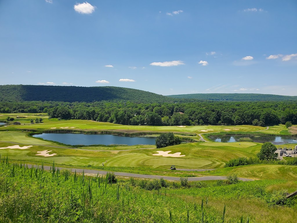 Panoramic view of a lush green golf course at Berkshire Valley Golf Course. Smooth