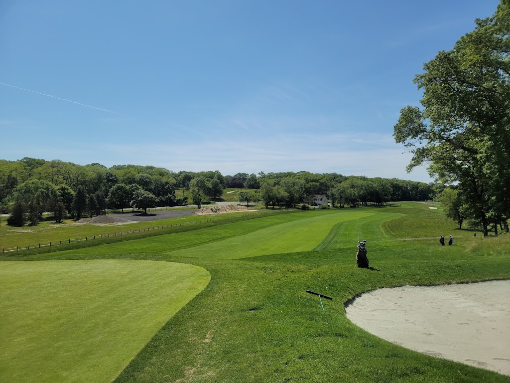 Panoramic view of a lush green golf course at Bethpage State Park. Smooth