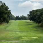 Panoramic view of a lush green golf course at Bethpage Yellow Golf Course. Smooth