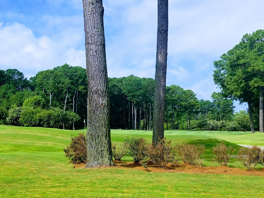 Panoramic view of a lush green golf course at Bide-A-Wee Golf Course. Smooth