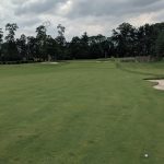 Panoramic view of a lush green golf course at Bidermann Golf Course. Smooth