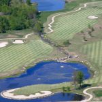 Panoramic view of a lush green golf course at Big Creek Country Club. Smooth