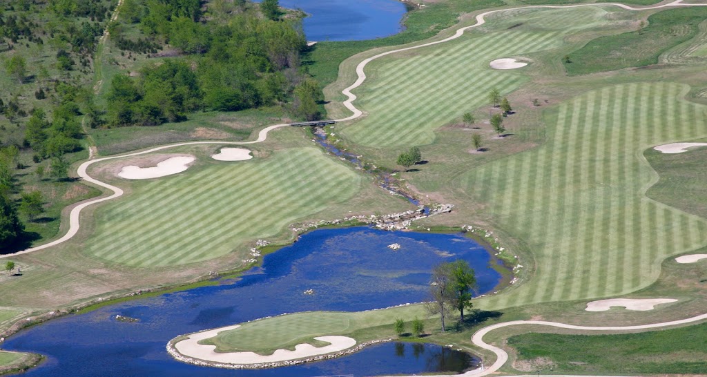 Panoramic view of a lush green golf course at Big Creek Country Club. Smooth