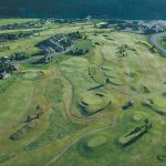 Panoramic view of a lush green golf course at Big Sky Golf Course & Nordic Center. Smooth
