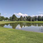 Panoramic view of a lush green golf course at Billings Par 3. Smooth