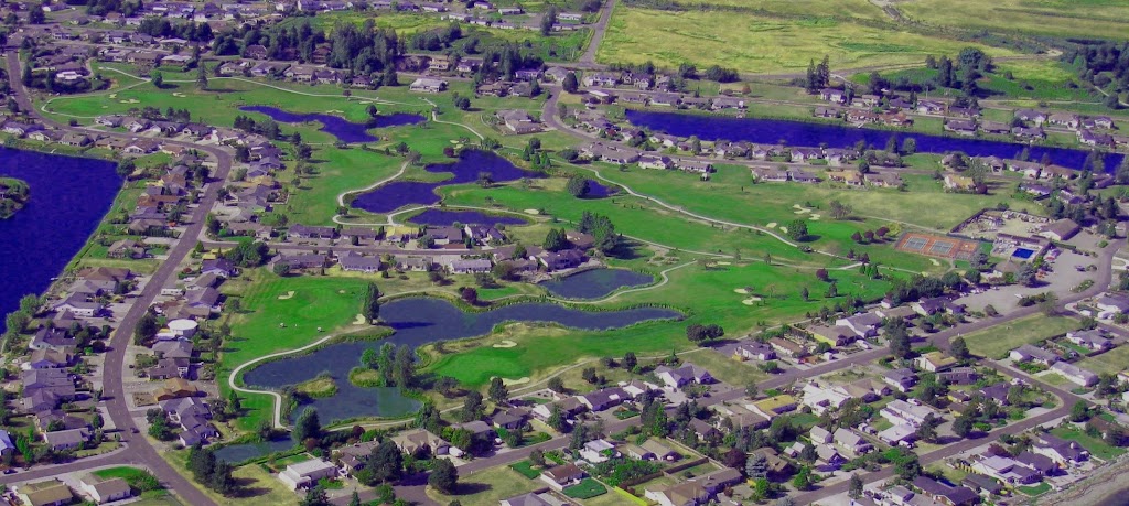 Panoramic view of a lush green golf course at Birch Bay Village Golf Course. Smooth