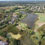 Panoramic view of a lush green golf course at Bittersweet Golf Club. Smooth