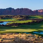 Panoramic view of a lush green golf course at Black Desert Golf Course. Smooth