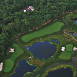 Panoramic view of a lush green golf course at Black Oak Golf Club