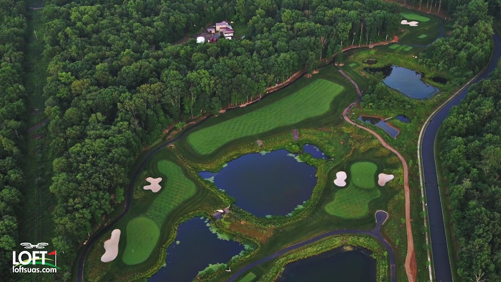 Panoramic view of a lush green golf course at Black Oak Golf Club
