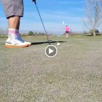 green grass with the flag in the hole.
