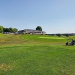 Panoramic view of a lush green golf course at Black Rock Golf Course. Smooth
