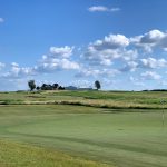 Panoramic view of a lush green golf course at Black Sheep Golf Club. Smooth