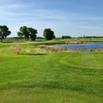 Panoramic view of a lush green golf course at Blackberry Ridge Golf Club. Smooth