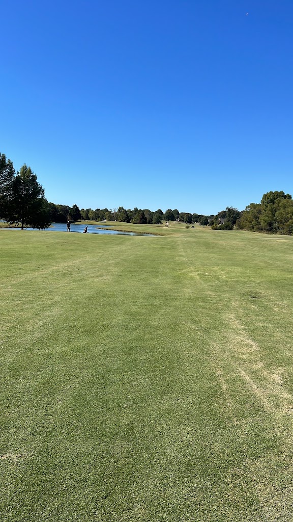 Panoramic view of a lush green golf course at Blackberry Trail Golf Course. Smooth