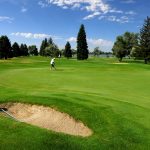 Panoramic view of a lush green golf course at Blackfoot Golf Course. Smooth