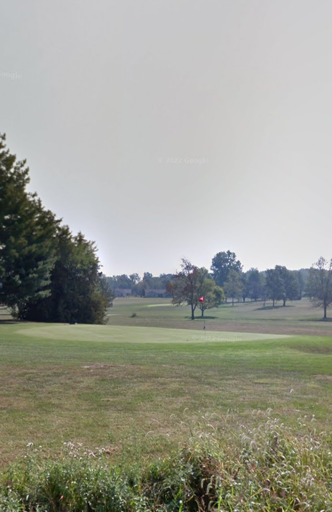 Panoramic view of a lush green golf course at Blackford Golf Club. Smooth