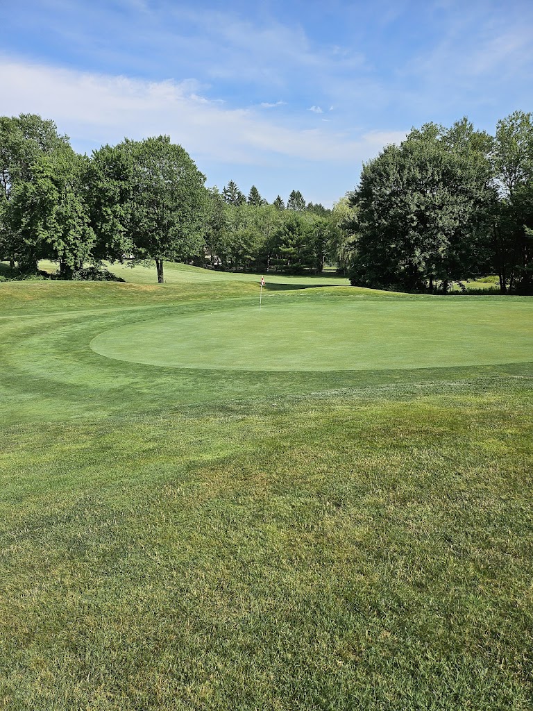 Panoramic view of a lush green golf course at Blackledge Country Club. Smooth