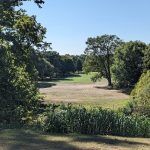 Panoramic view of a lush green golf course at Blacklick Woods Golf Course. Smooth