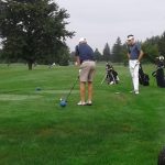 green grass with the flag in the hole.