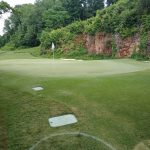 Panoramic view of a lush green golf course at Blessings Golf Club. Smooth