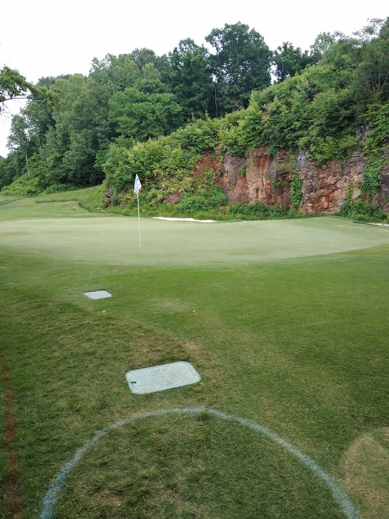 Panoramic view of a lush green golf course at Blessings Golf Club. Smooth