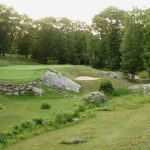 Panoramic view of a lush green golf course at Blissful Meadows Golf Club.. Smooth
