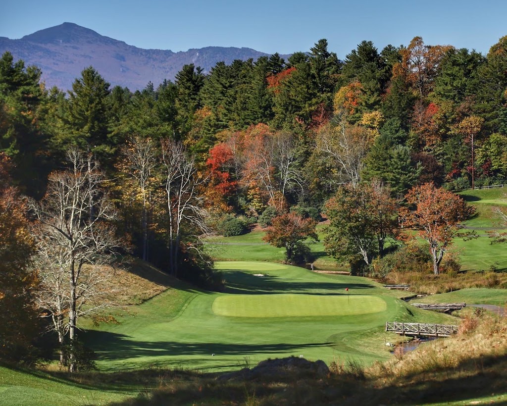 Panoramic view of a lush green golf course at Blowing Rock Country Club. Smooth