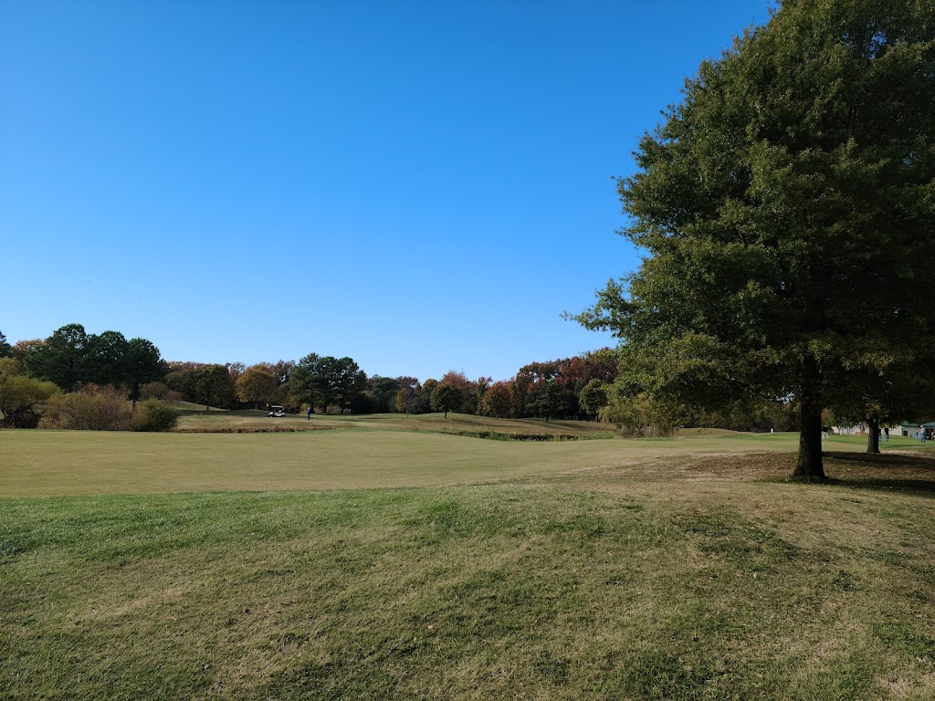 Panoramic view of a lush green golf course at Blue Heron Golf Course. Smooth