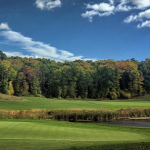 Panoramic view of a lush green golf course at Blue Ridge Trail Golf Club. Smooth