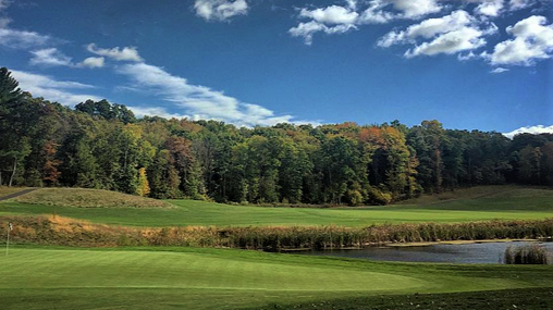 Panoramic view of a lush green golf course at Blue Ridge Trail Golf Club. Smooth