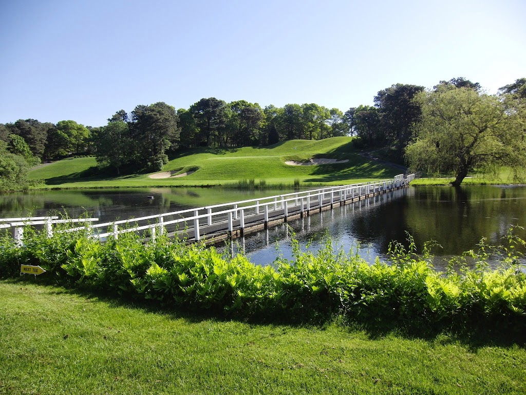 Panoramic view of a lush green golf course at Blue Rock Golf Course. Smooth