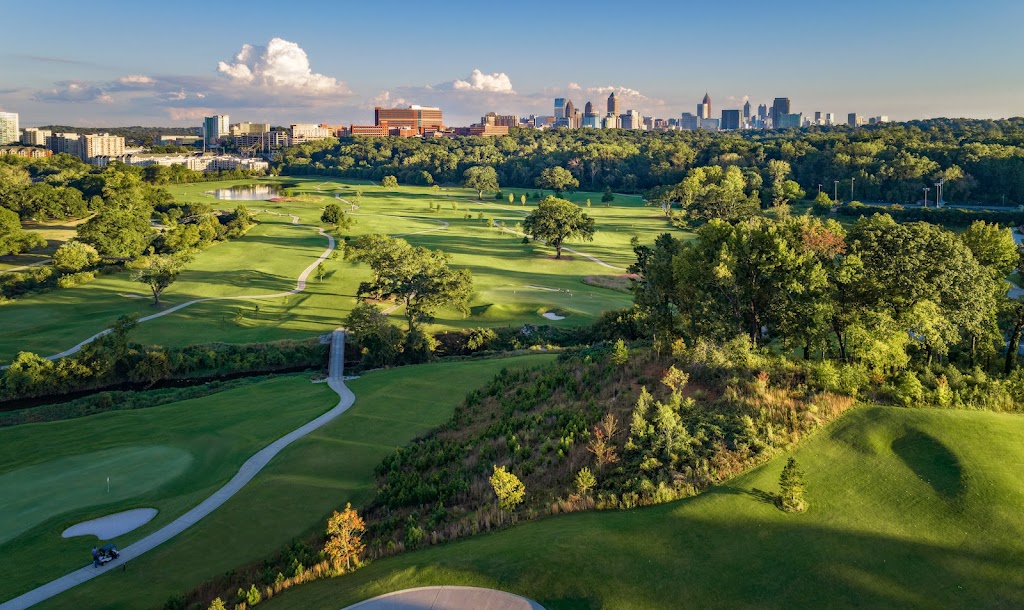 Panoramic view of a lush green golf course at Bobby Jones Golf Course. Smooth