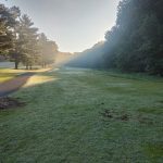 Panoramic view of a lush green golf course at Bobby Nichols Golf Course. Smooth