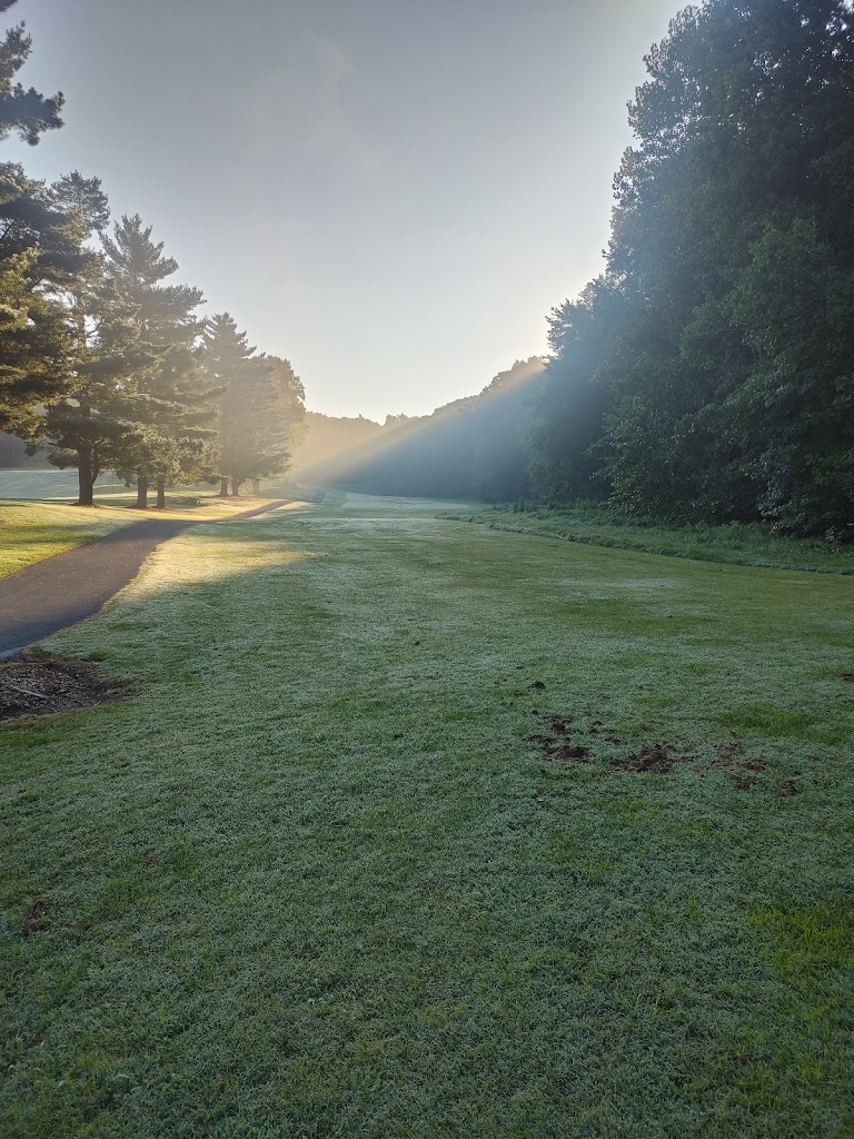 Panoramic view of a lush green golf course at Bobby Nichols Golf Course. Smooth