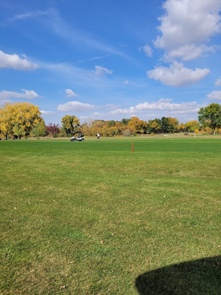 Panoramic view of a lush green golf course at Bois de Sioux Golf Course. Smooth
