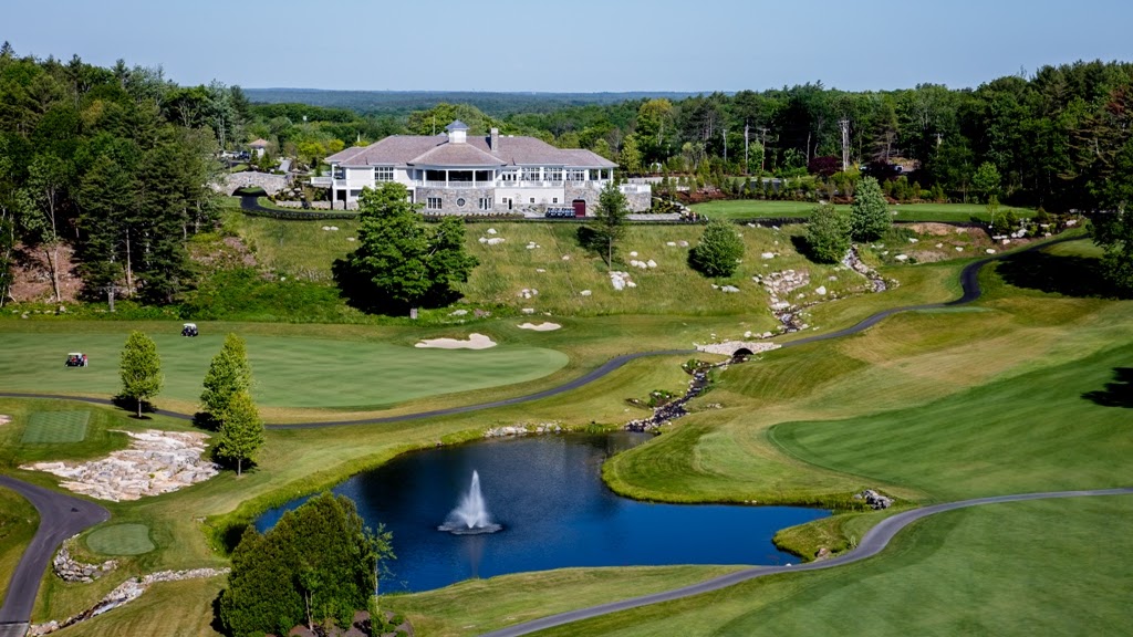 Panoramic view of a lush green golf course at Boothbay Harbor Country Club. Smooth