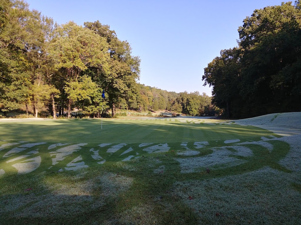 Panoramic view of a lush green golf course at Boots Randolph Golf Course. Smooth