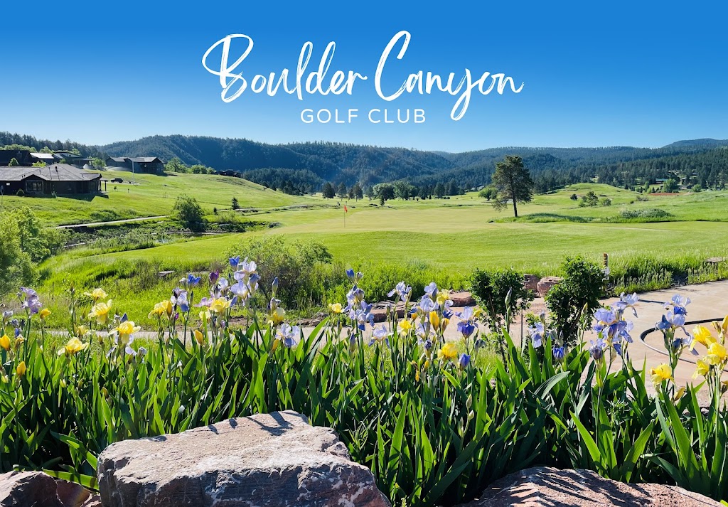 Panoramic view of a lush green golf course at Boulder Canyon Golf Club. Smooth