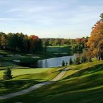 Panoramic view of a lush green golf course at Boulder Creek Golf Club & Event Center. Smooth