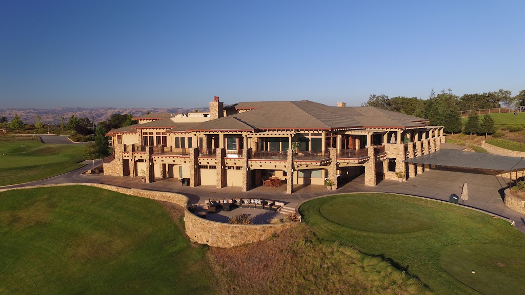 Panoramic view of a lush green golf course at Boulder Ridge Golf Club. Smooth
