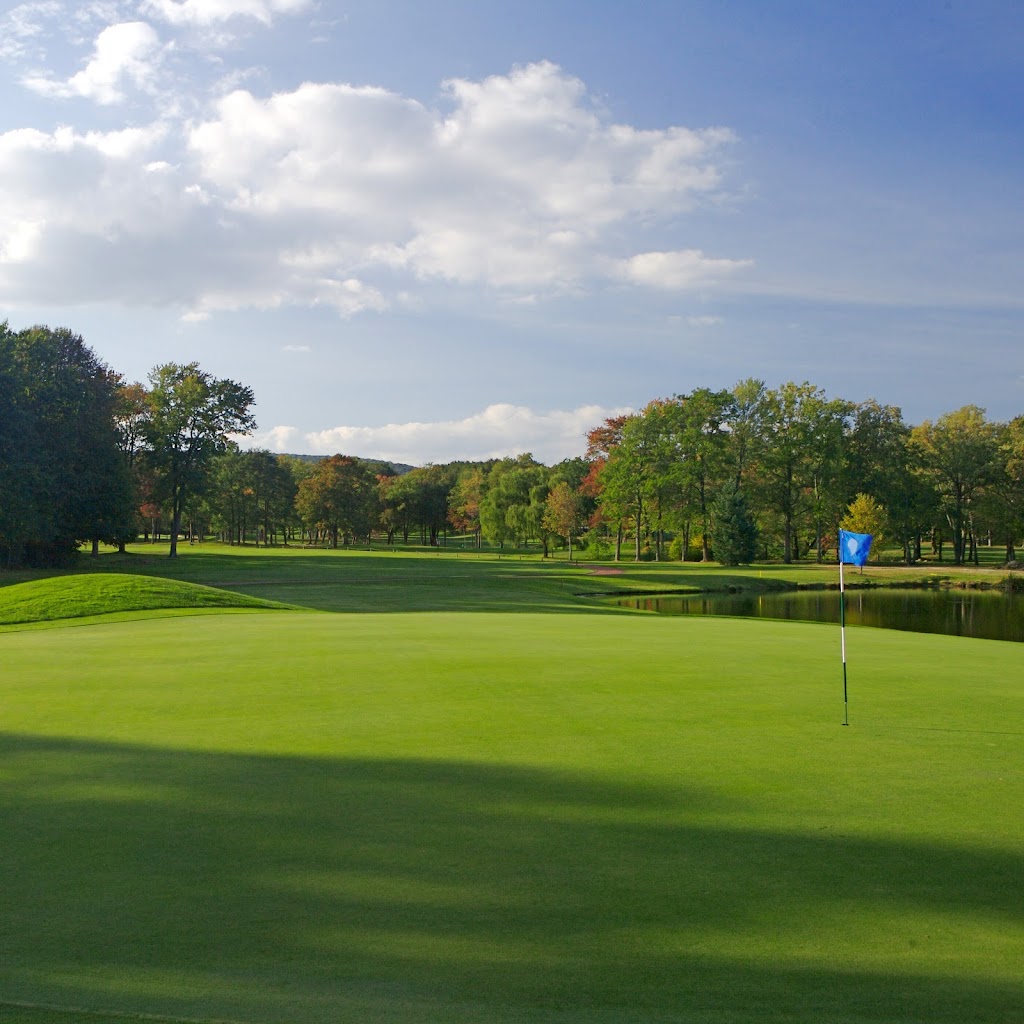 Panoramic view of a lush green golf course at Bowling Green Golf Club. Smooth