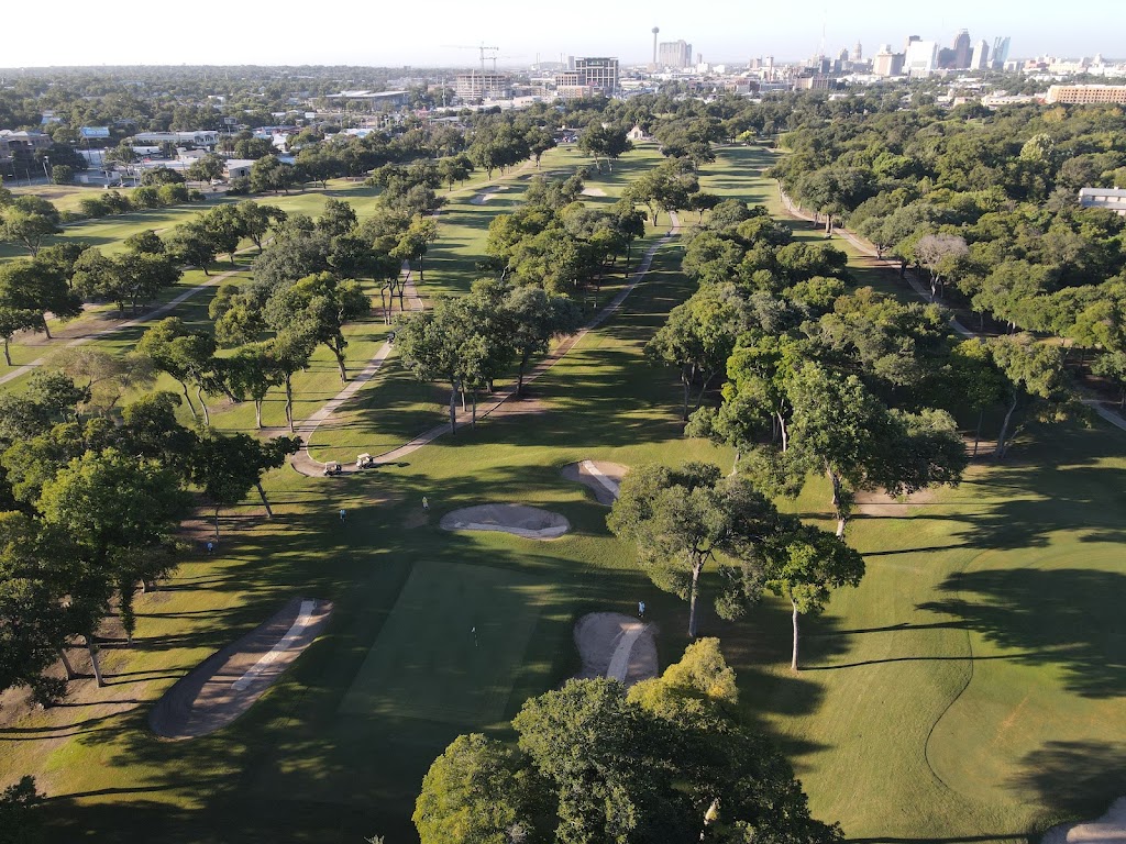 Panoramic view of a lush green golf course at Brackenridge Park Golf Course. Smooth