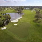 Panoramic view of a lush green golf course at Bradenton Country Club. Smooth