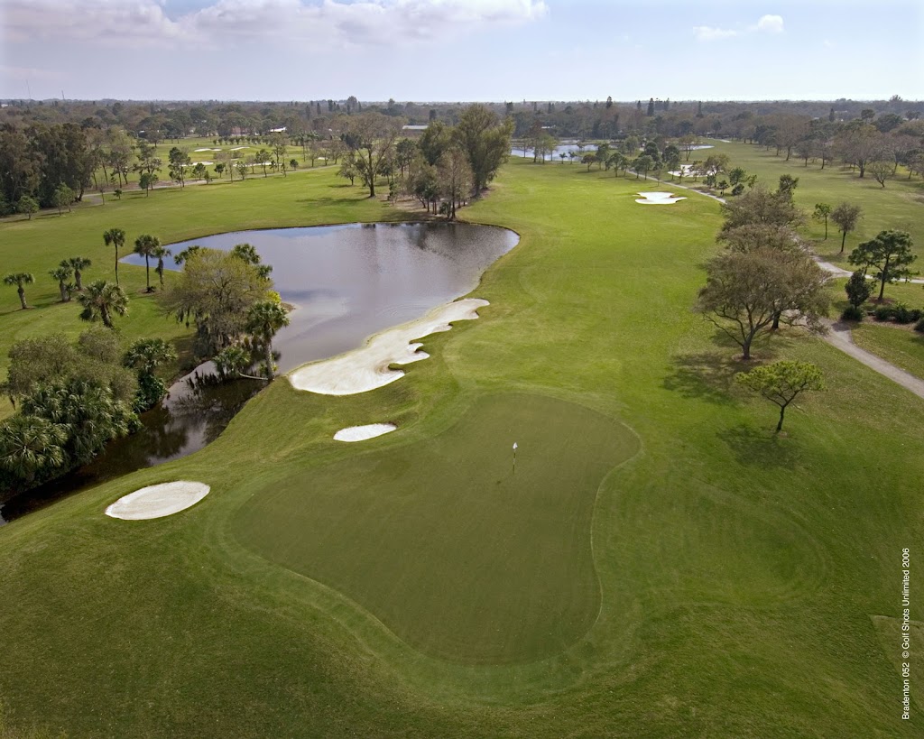 Panoramic view of a lush green golf course at Bradenton Country Club. Smooth