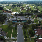 Panoramic view of a lush green golf course at Bradenton Country Club. Smooth