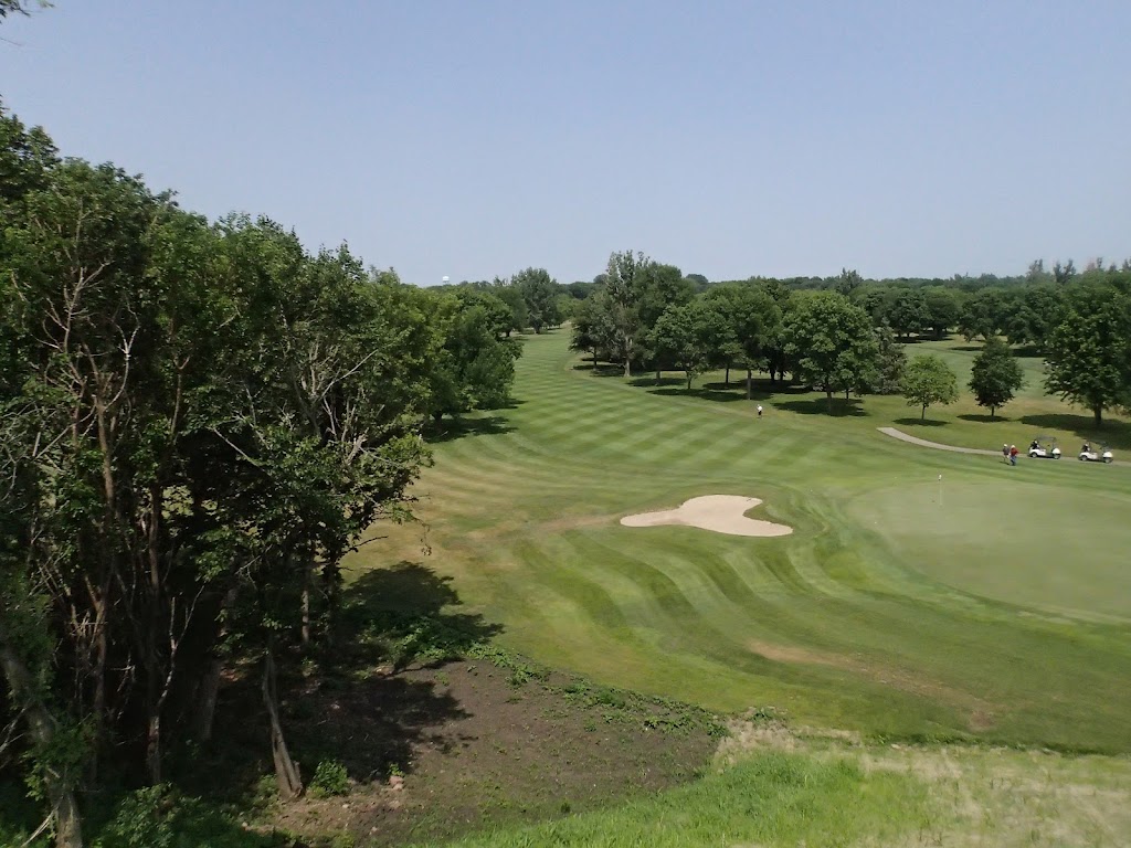Panoramic view of a lush green golf course at Brandon Golf Course. Smooth