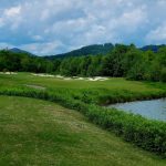 Panoramic view of a lush green golf course at Brasstown Valley Golf Club. Smooth