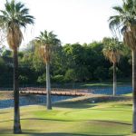 Panoramic view of a lush green golf course at Brea Creek Golf Course. Smooth