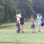 green grass with the flag in the hole.